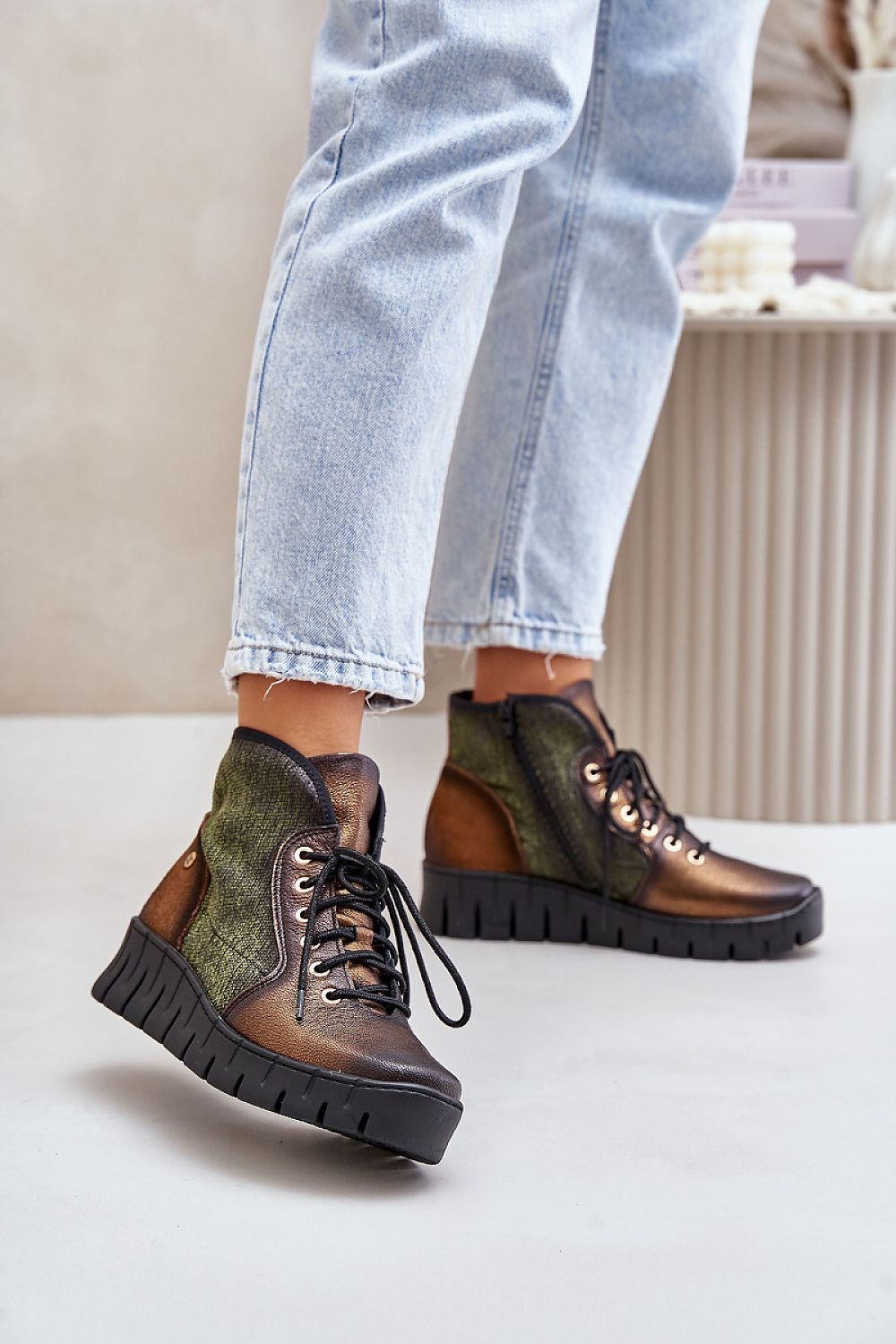 Thessari Groundline Leather Utility Boots with platform heel, in brown and green, showcasing rugged design and comfortable fit.