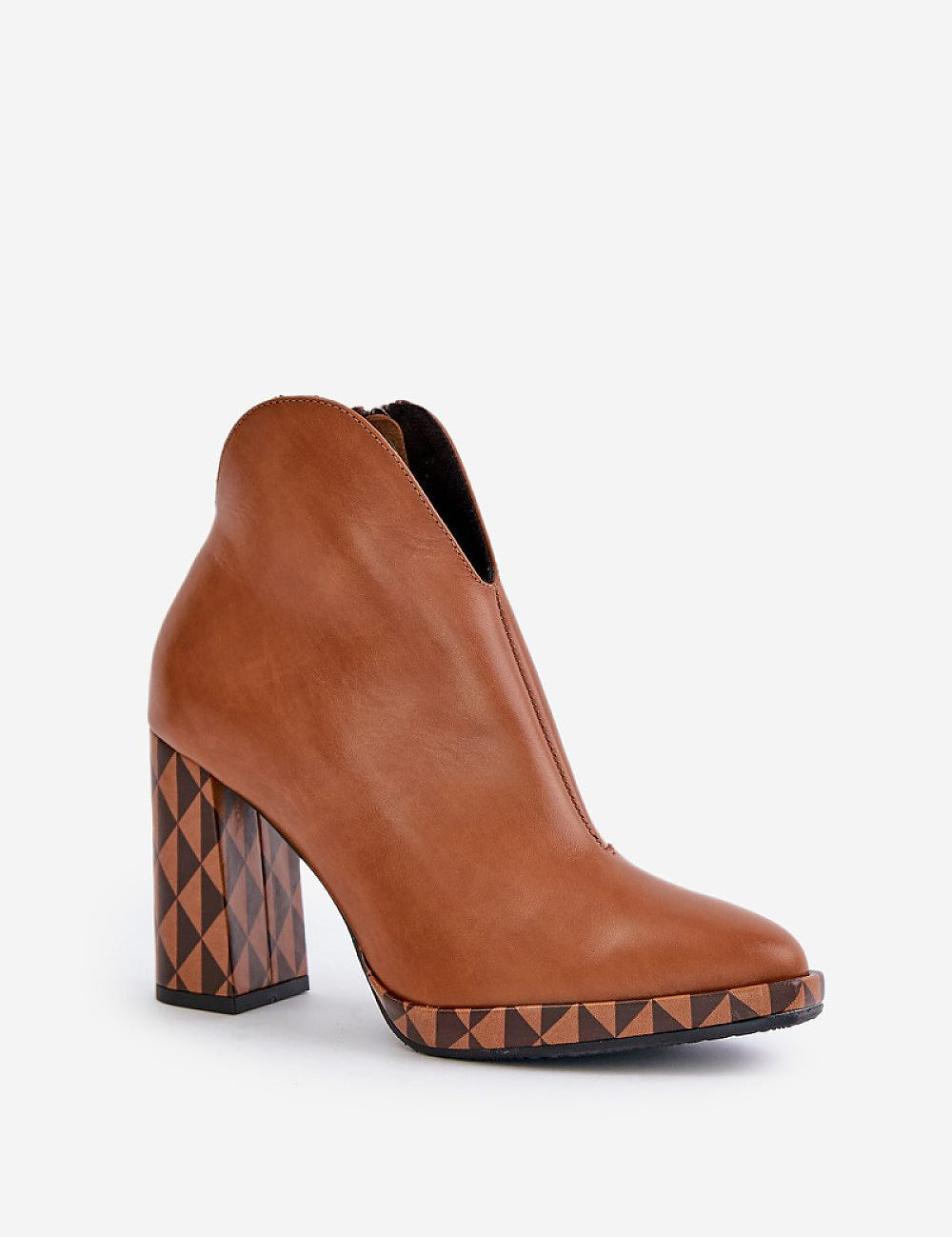 Brown leather ankle boot with geometric patterned block heel and sleek design, showcasing a modern, edgy style.