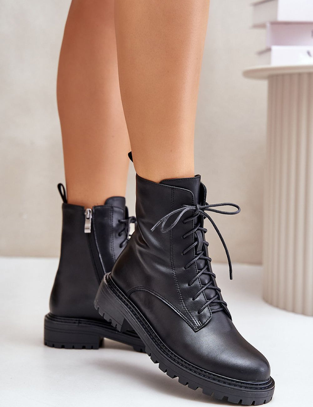 Arvenna Insulated Everyday Boots in black leather, with classic lacing, side zipper, and flat heel for urban winter comfort.