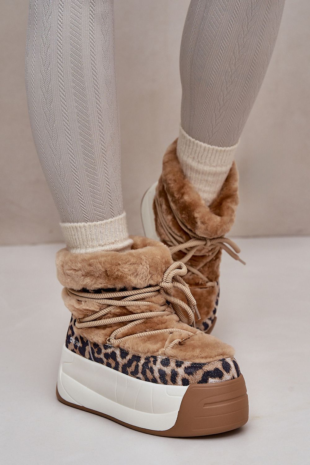 Alt Tag: Velmara fur-lined snow boots with high-grip sole and cozy interior, perfect for winter, featuring stylish leopard print design.