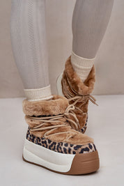 Alt Tag: Velmara fur-lined snow boots with high-grip sole and cozy interior, perfect for winter, featuring stylish leopard print design.
