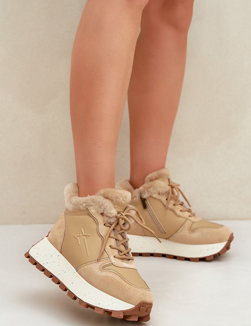 Tan Alvarra Leather Platform Winter Sneakers with fur lining, brown soles, and dual closure design for warmth and style on cold days.