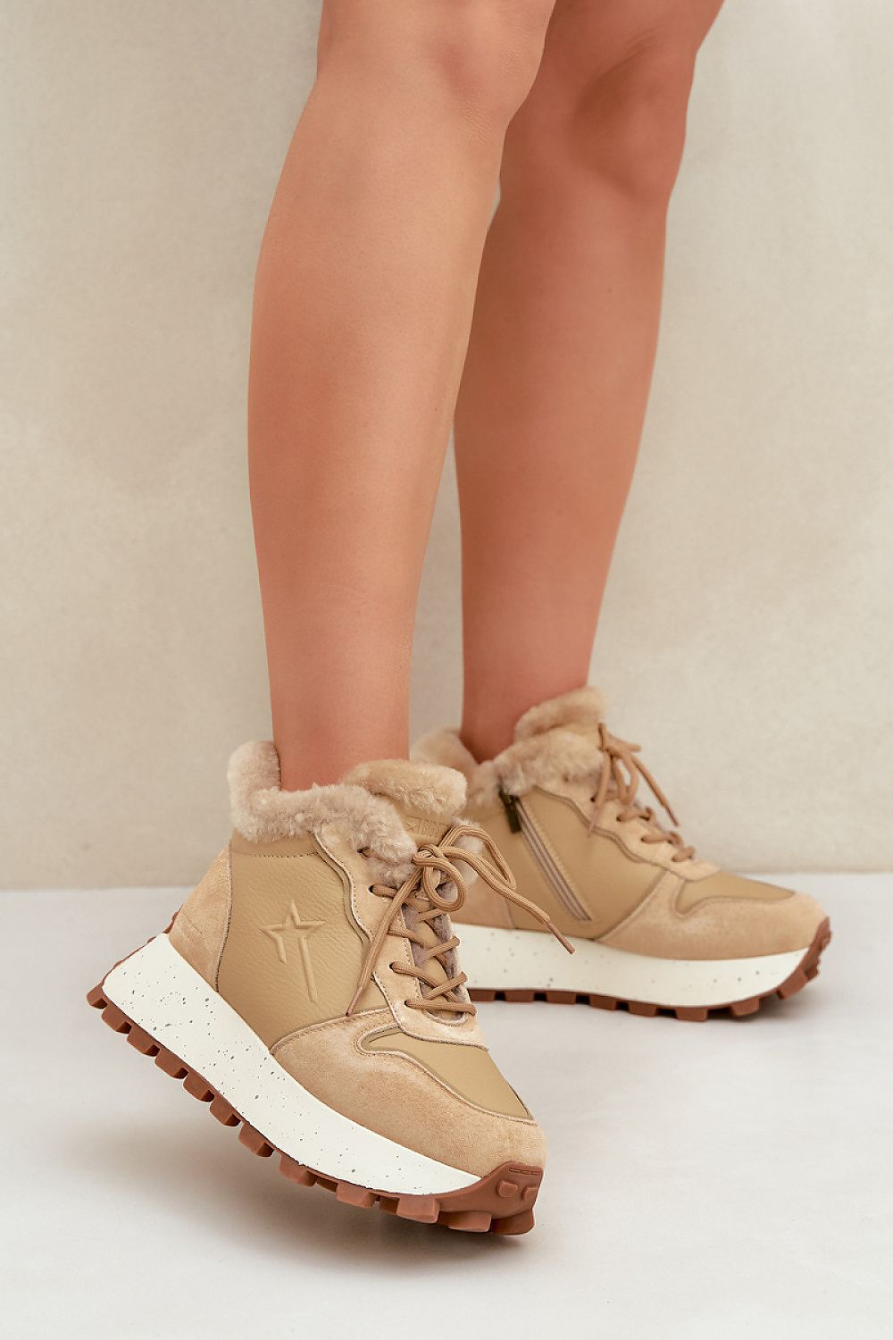 Tan Alvarra Leather Platform Winter Sneakers with fur lining, brown soles, and dual closure design for warmth and style on cold days.