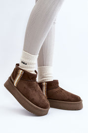 Azmira Aztec Platform Snow Boots in brown eco suede with Aztec pattern, thick platform for warmth, worn with white socks, side view.