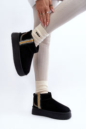 Woman wearing Azmira Aztec Platform Snow Boots in black with Aztec pattern, eco suede, plush fur lining, and 4 cm platform.