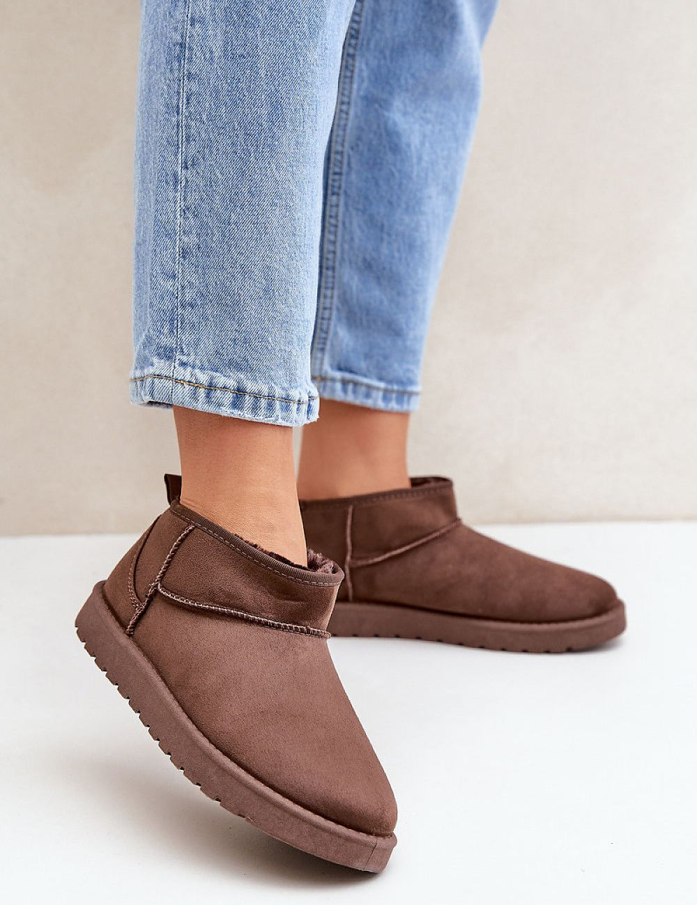 Morvenna brown suede snow boots with fur lining, shown on person wearing jeans, ideal for warmth and style in cold weather.