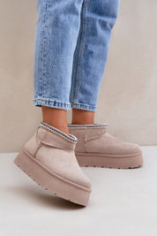 Auraline embroidered suede snow boots with fur lining, worn with jeans, featuring a 4 cm platform and 9.5 cm shaft height.