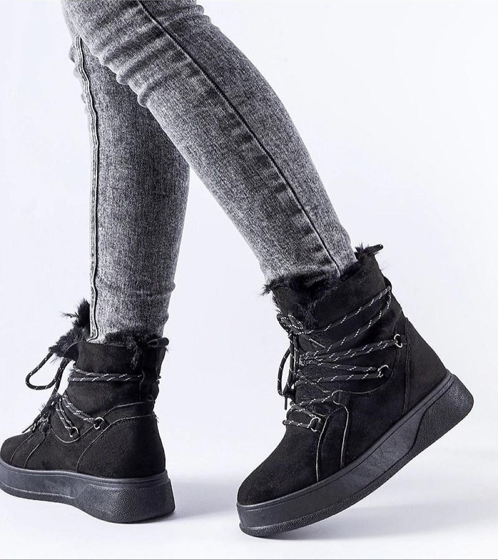 Person wearing Darnelle Platform Winter Snow Boots with 4 cm platform, eco leather, and insulated lining for cold weather protection.