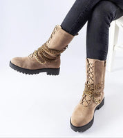Selvaya Chain-Detail Ankle Boots with decorative chain and side zipper, paired with jeans, showcasing winter style and practicality.