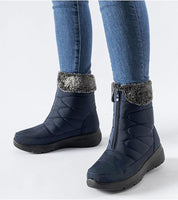 Woman wearing Avenlinn Wedge Zip-Up Snow Boots in navy blue, featuring a 4.5 cm wedge heel, fleece trim, and zip-up closure for warmth.