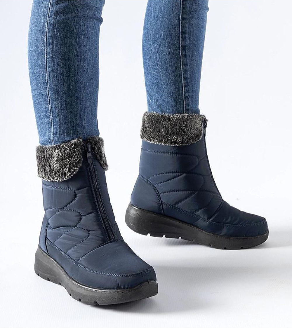 Woman wearing Avenlinn Wedge Zip-Up Snow Boots with jeans, showing side zip closure and durable rubber soles.