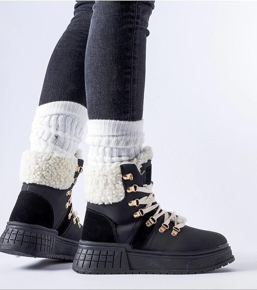 Person wearing Drosmere Platform Work Boots with warm insulated interior and 5 cm platform sole, featuring bold stitched detailing.