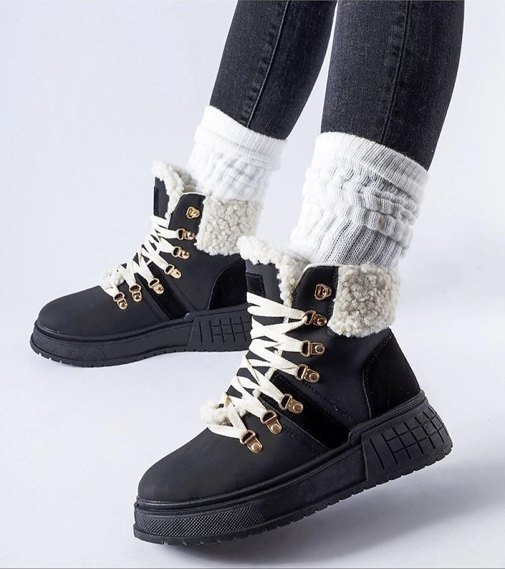 Person wearing Drosmere Platform Work Boots with high ankle cut, laced closure, and insulated interior for comfort and grip.