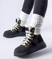 Person wearing Drosmere Platform Work Boots with high ankle cut, laced closure, and insulated interior for comfort and grip.