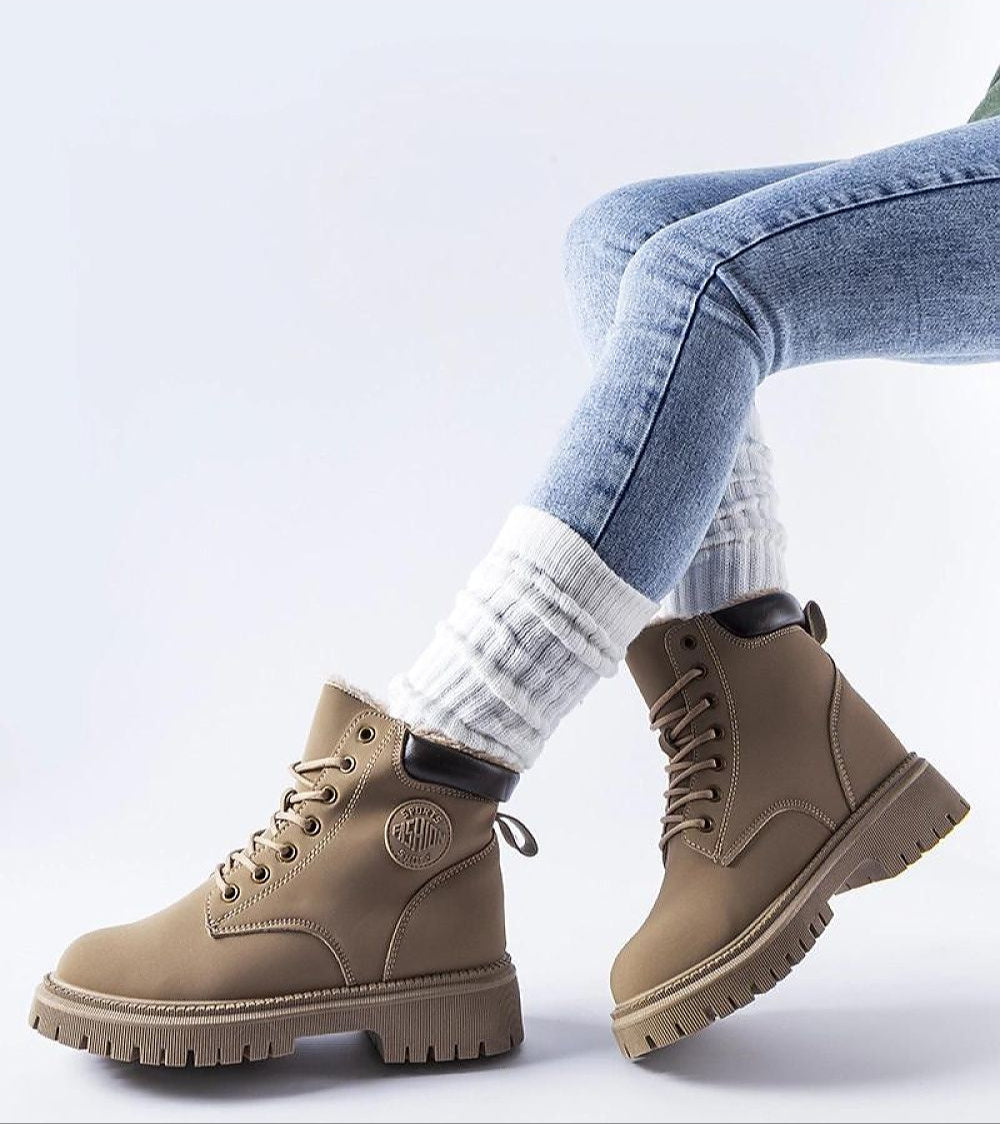 Tharvain Insulated Trapper Boots in brown with sturdy laced closure, high-cut silhouette, and rubber sole for winter fashion.