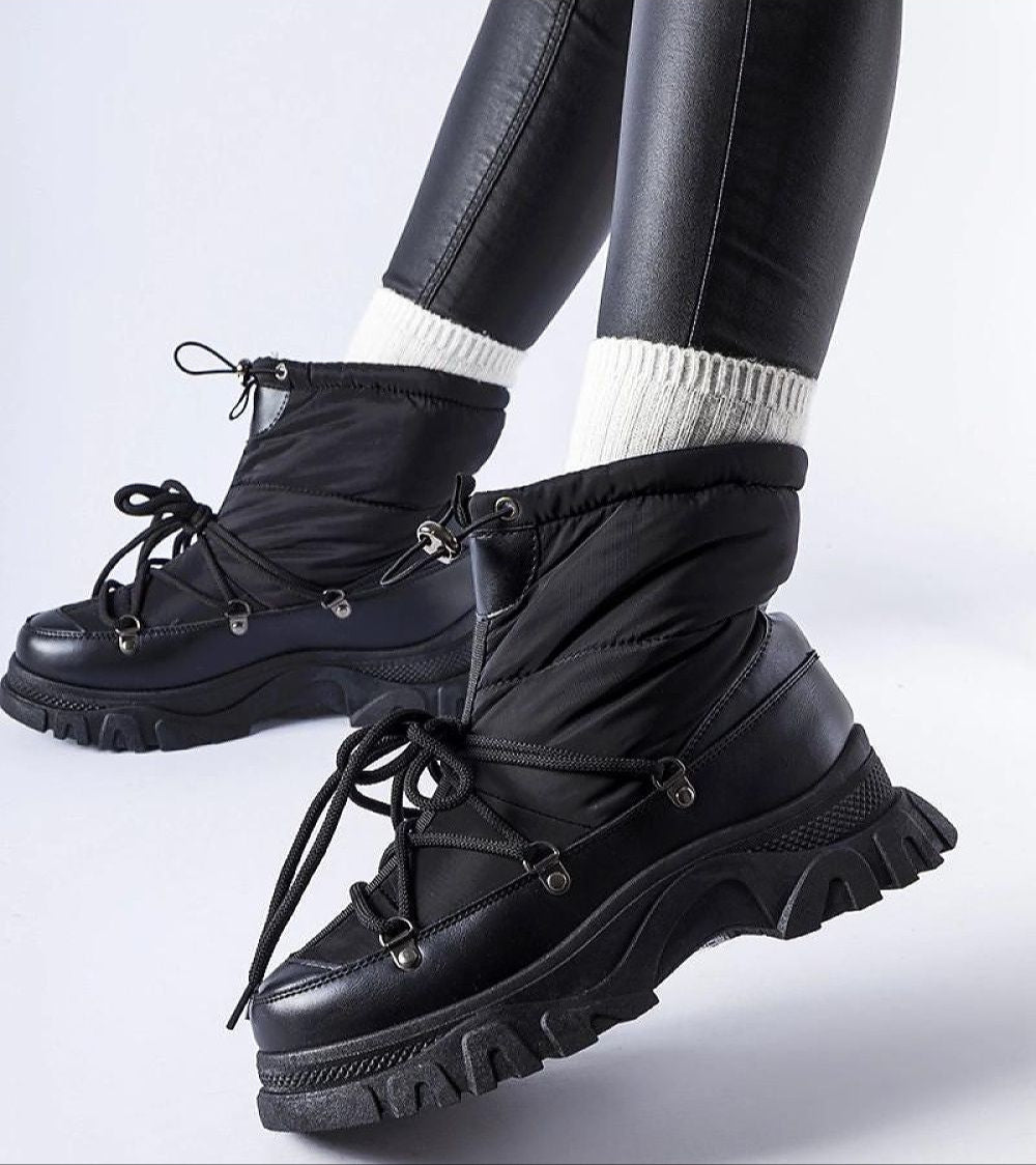 Eldarien Lace-Up Snow Boots with waterproof design, round toe, and mid-height heel, ideal for winter city wear and snowy conditions.