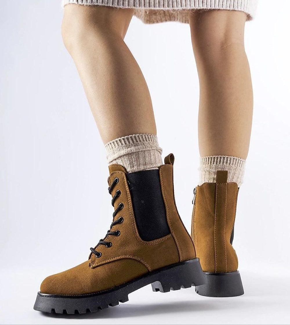 Everleigh Ridge Winter Boots with chunky sole, eco-leather upper, and side zipper, shown styled with socks for cold weather.