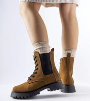 Everleigh Ridge Winter Boots with chunky sole, eco-leather upper, and side zipper, shown styled with socks for cold weather.