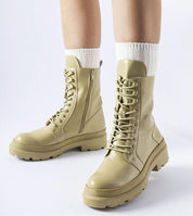 Vereliane Winter Boots with high ankle silhouette, rubberized exterior, and side zipper, ideal for protection against rain and snow.