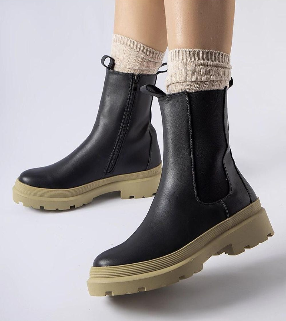 Vereliane ankle boots with vegan leather, olive sole, and side zipper for comfort and style in transitional wardrobes.