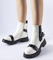 Stylish white insulated ankle boots with black chunky soles and a comfortable 5 cm heel, perfect for autumn fashion and warmth.