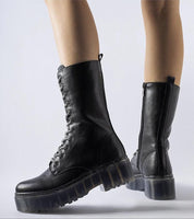 Black Ardénne insulated winter boots with lace-up design, durable eco leather, and mid-high silhouette for warmth and style.