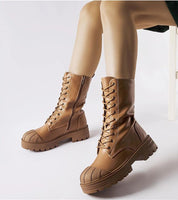 Thavine insulated lace-up work boots in brown eco leather with high-cut shaft and 4.5 cm heel for warmth and durability.