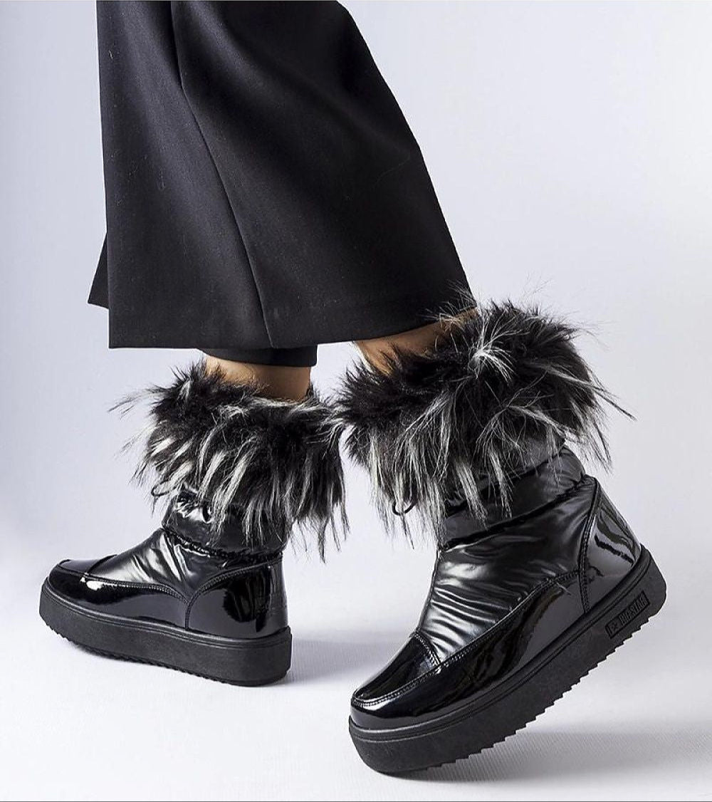 Lureysa Big Star insulated snow boots with patent shine, eco leather, tall shaft, and fur trim, worn by a person in black pants.