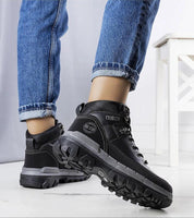 Person wearing Elvora Big Star insulated winter sneakers with thick sole for comfort and warmth, featuring urban sporty design.