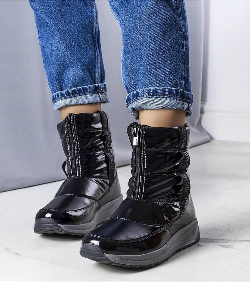 Orymira insulated platform snow boots with opalescent finish, black sole, and plush fur lining, showcasing winter footwear style.