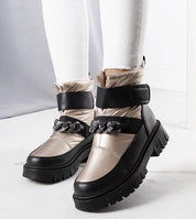 Solvara winter chain snow boots with metallic chain, waterproof panels, eco leather, thick sole, and Velcro fastening, styled on feet.