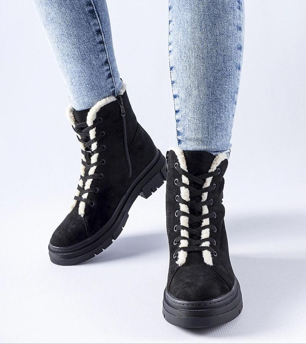 Black Pombera Suede Platform Boots with cozy lining and side zipper, offering style and warmth for winter outfits.
