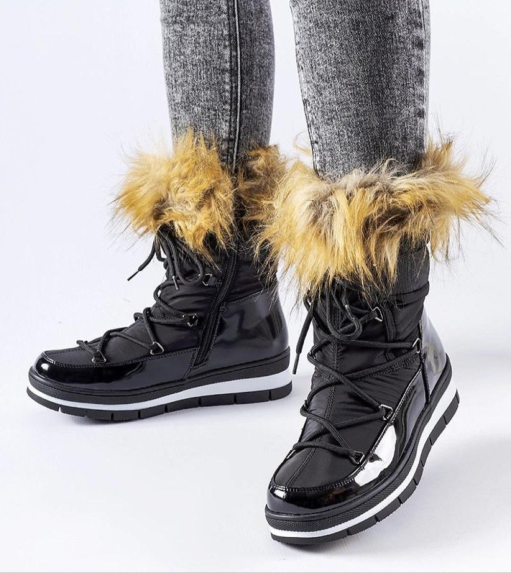 Glossy winter boots with faux fur trim and side zipper, offering warmth and style. Knee-high design with discreet platform and bow detail.