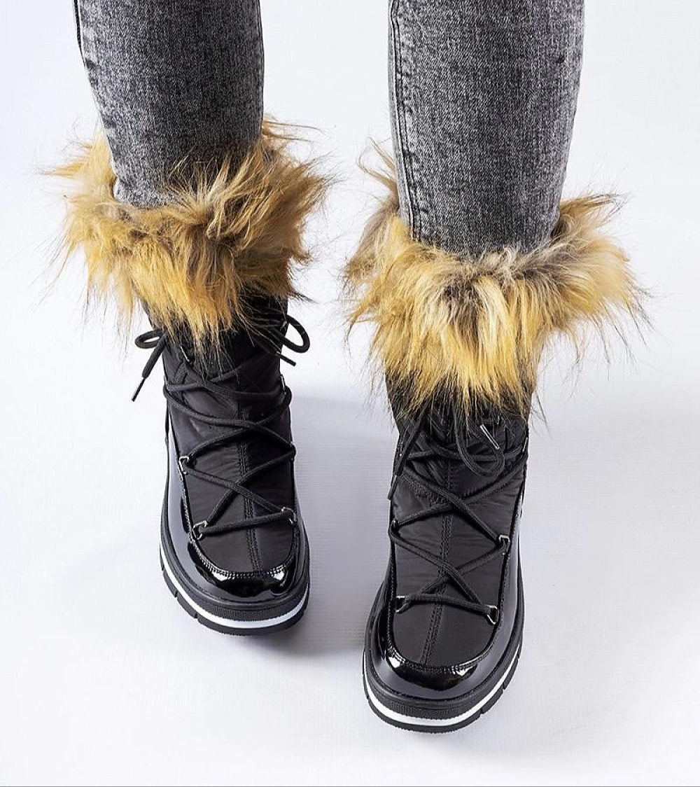 Woman wearing Furelle Gloss Winter Boots with faux fur trim and glossy finish