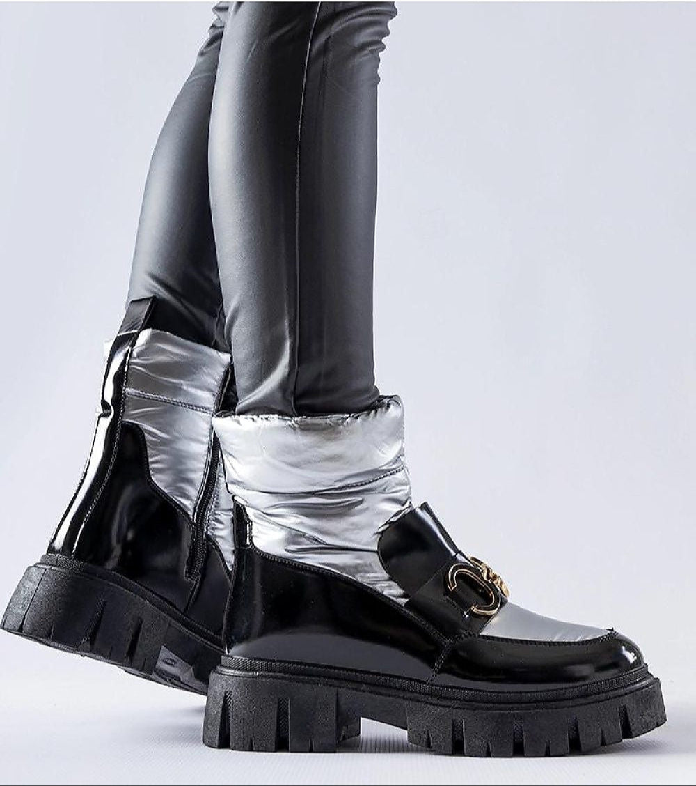 Nevelle Insulated Lacquered Snow Boots in black and silver, featuring a glossy finish, side zipper, and sturdy rubber sole for winter wear.