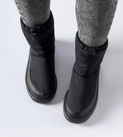 Black Sylverra Slip-On Winter Snow Boots with subtle platform and waterproof sole, designed for warmth and style in snowy conditions.