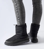 Sylverra Slip-On Winter Snow Boots with waterproof rubber sole and sleek design, perfect for icy conditions.