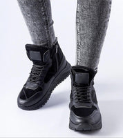 Black Tharmin Winter Lace-Up Sneakers with eco leather and insulated lining for warmth, durable rubber sole for traction on icy surfaces.