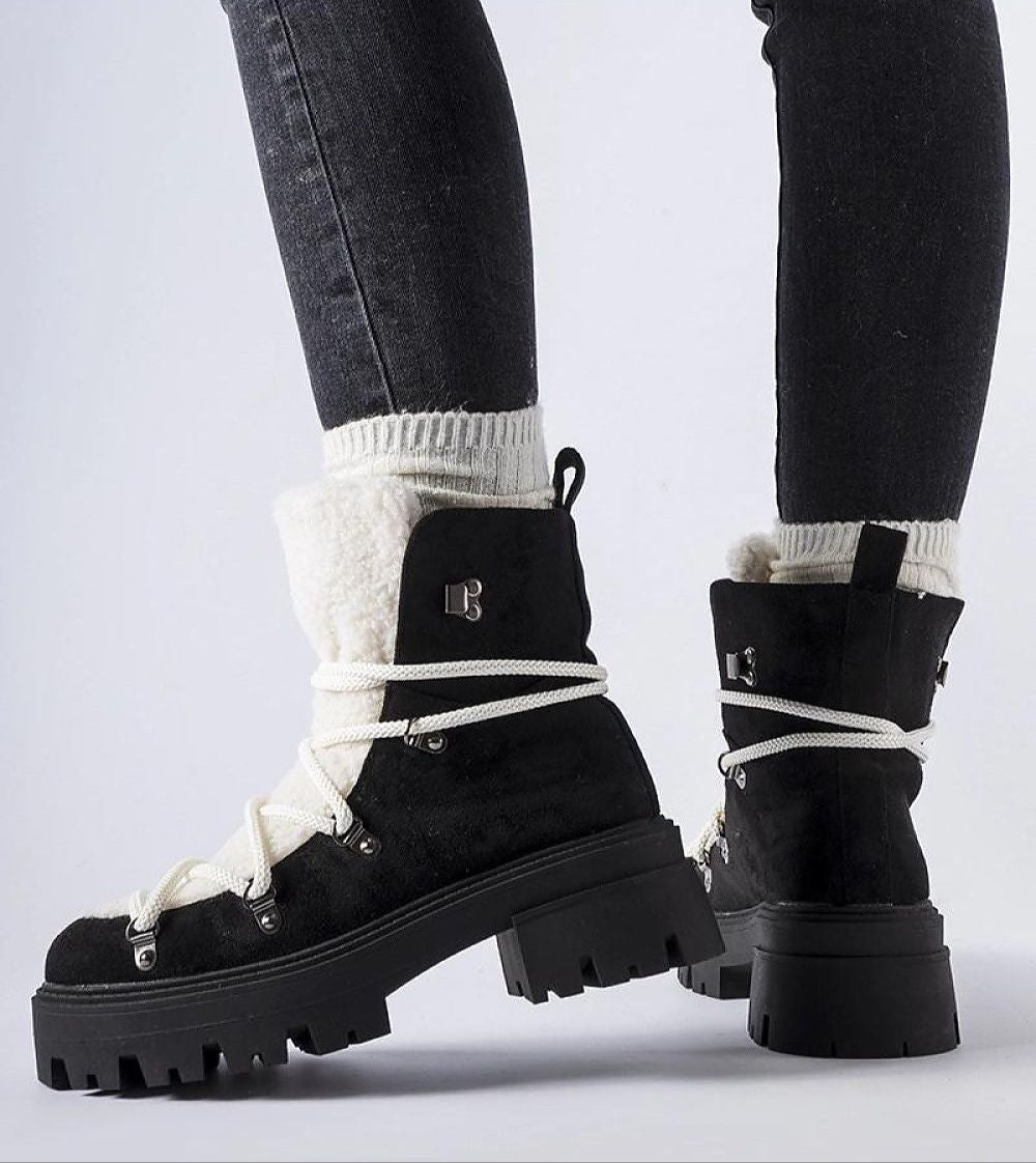 Black Perivana Lace-Up Winter Baggers with white laces and fluffy lining, showcasing durable eco leather and rugged rubber outsole.