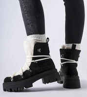 Black Perivana Lace-Up Winter Baggers with white laces and fluffy lining, showcasing durable eco leather and rugged rubber outsole.