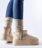 Caldessa Platform Insulated Snow Boots with eco-leather upper, platform sole, and ankle-high design, styled with jeans and socks.