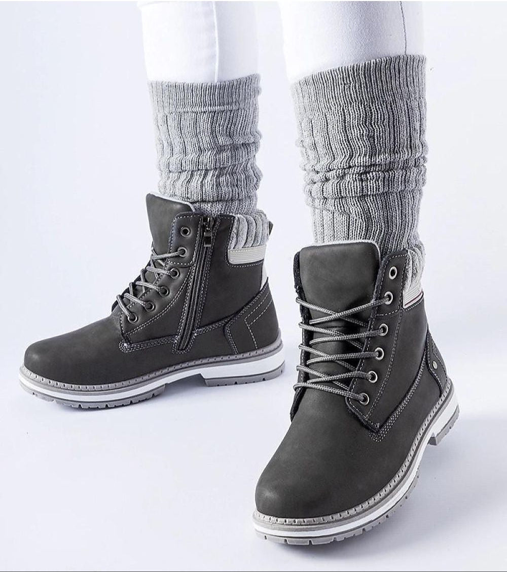 Veltrana Waterproof Insulated Trappers in grey with eco leather and side zipper, worn with white pants and grey knit socks