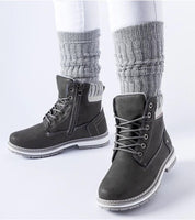 Veltrana Waterproof Insulated Trappers in grey with eco leather and side zipper, worn with white pants and grey knit socks