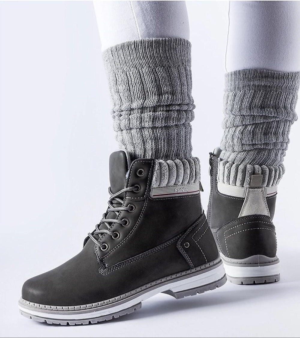 Black Veltrana Waterproof Insulated Trappers with high ankle cut, eco leather, soft insulation, and side zipper for winter comfort.