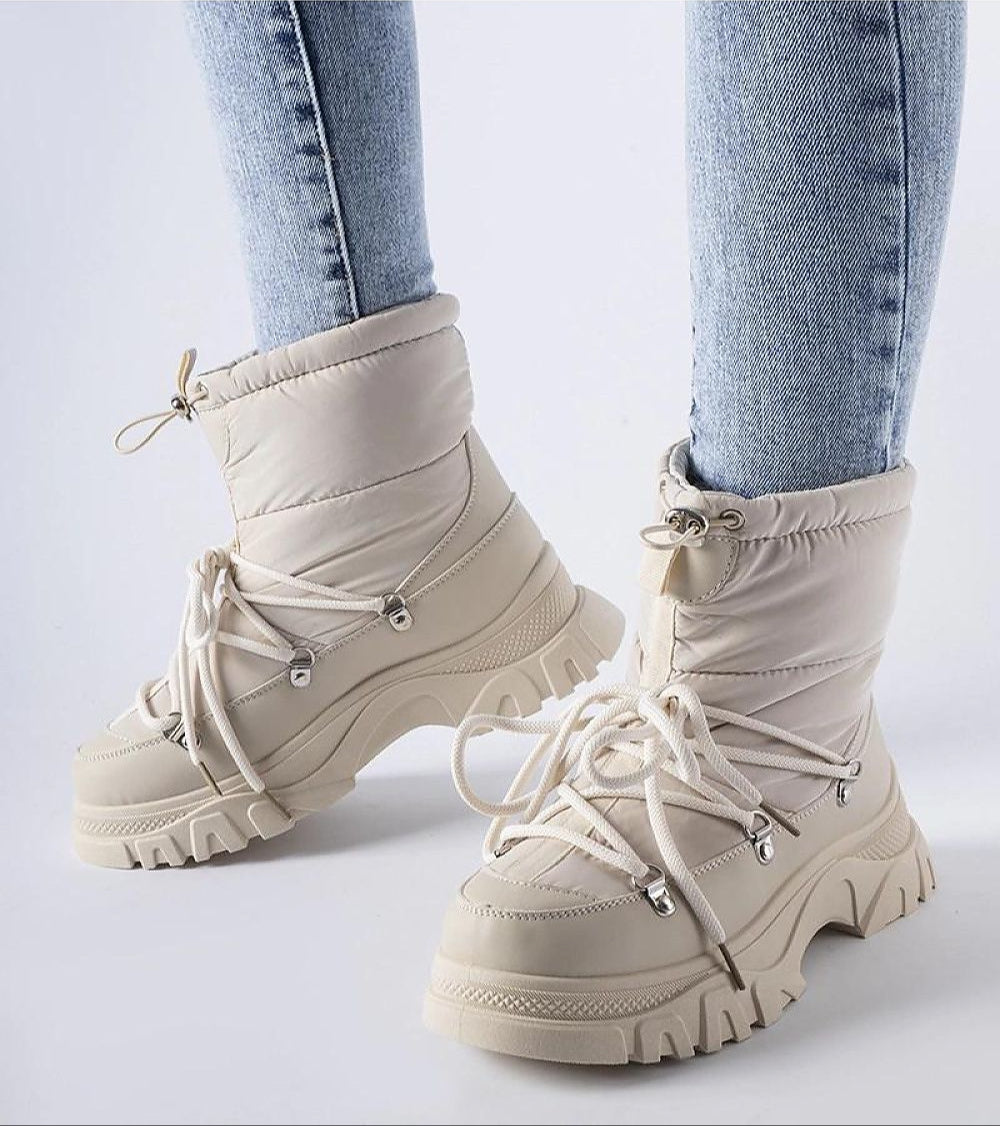 Eldarien Lace-Up Snow Boots with waterproof rubber outer, insulating thermal lining, round toe, and comfortable mid-height heel.