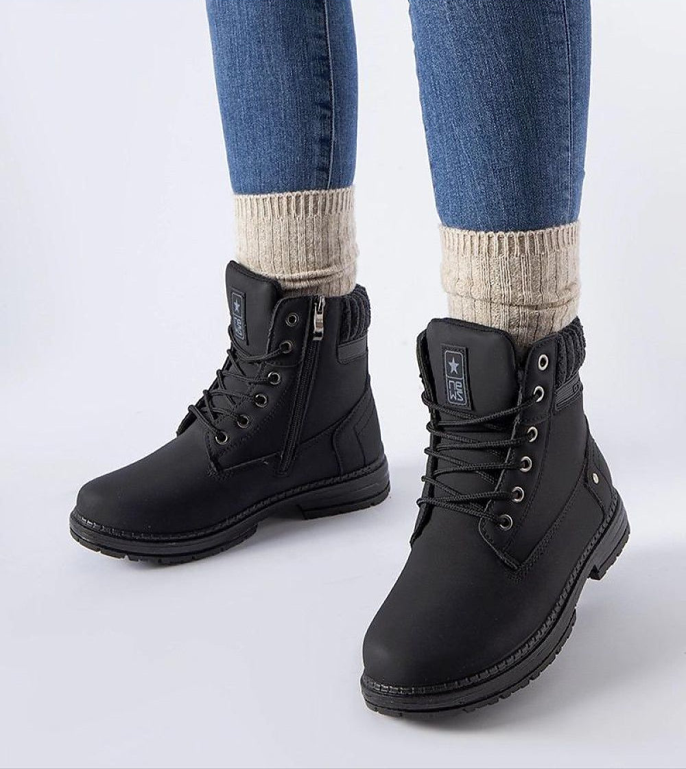 Arauja waterproof insulated trappers in black eco leather with high upper, laces, side zipper, worn with jeans and thick socks.