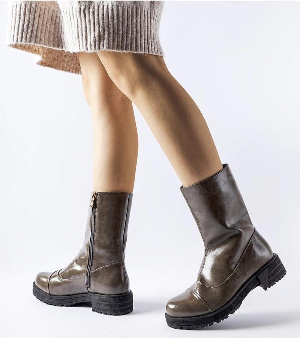 Women's Averana insulated ankle boots in eco leather with flat soles and side zippers, ideal for cold weather wear, shown on model.