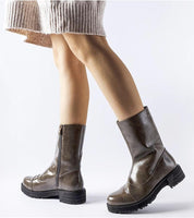 Women's Averana insulated ankle boots in eco leather with flat soles and side zippers, ideal for cold weather wear, shown on model.