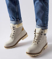 Montalbino Insulated Winter Trappers in beige worn with jeans, showcasing warmth and comfort for icy conditions.