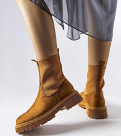 Solmare Eco-Suede Slip-On Boots with medium heel and rubber sole, showcasing elegant autumn style and durable comfort.